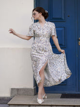 A lady wears a floral dress